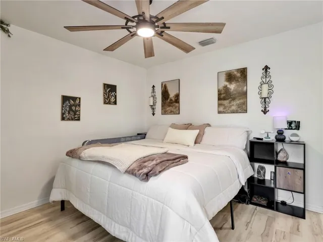 Bedroom featuring light wood-type flooring and ceiling fan