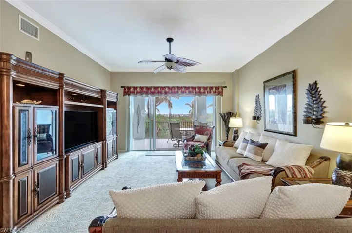 Carpeted living room furnished with Tommy Bahama