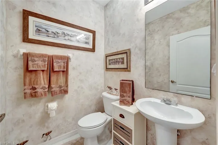 Bathroom with sink and toilet