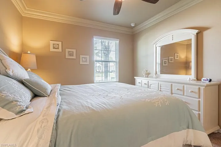 Bedroom featuring crown molding and ceiling fan