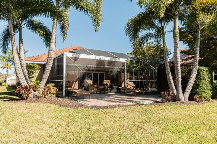 View of yard featuring a lanai and a patio area