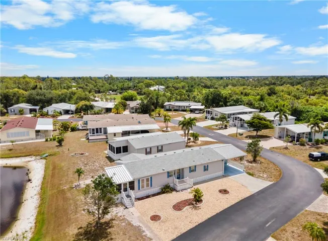Aerial perspective showcasing a community of homes with a natural landscape backdrop