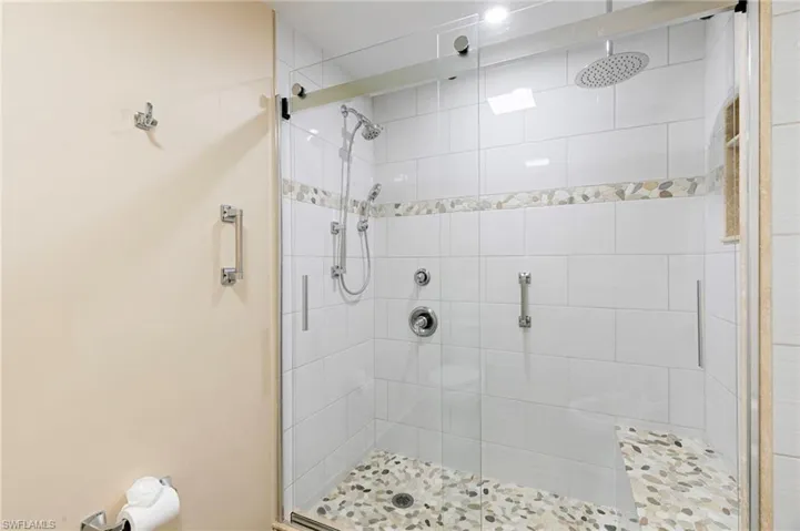 Full bathroom with a stall shower