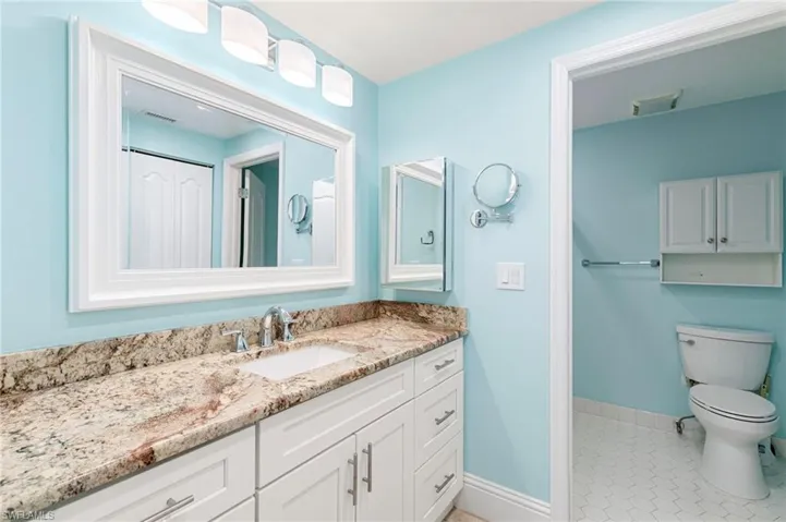 Bathroom with vanity and light tile patterned floors