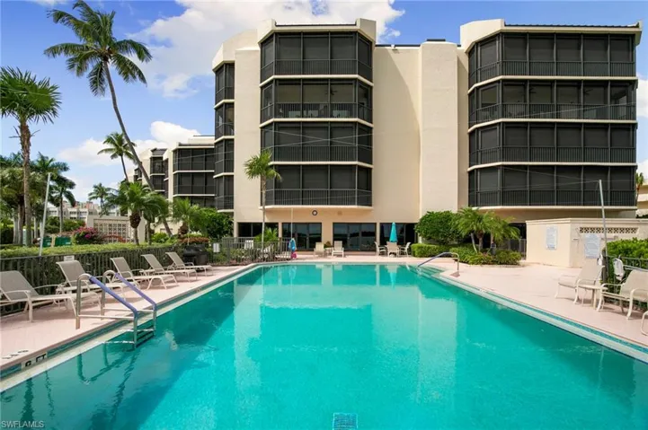 Community pool featuring a patio