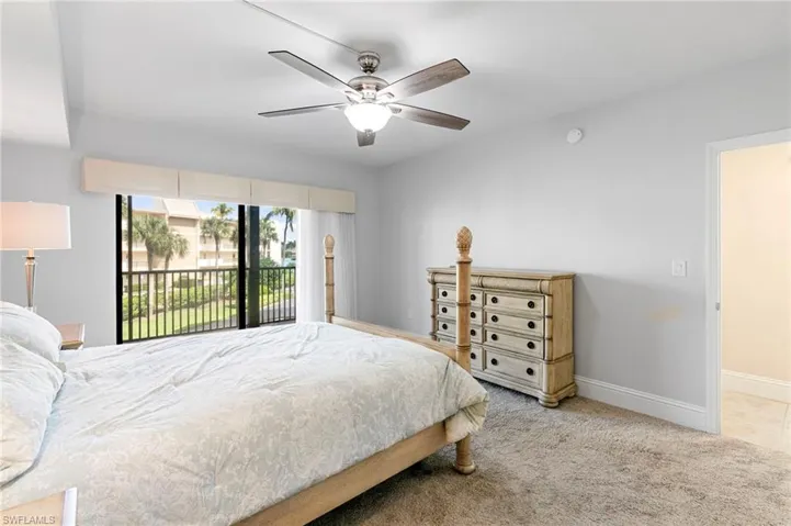 Bedroom with carpet floors, access to exterior, and ceiling fan