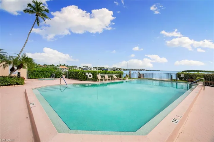 Community pool featuring a patio