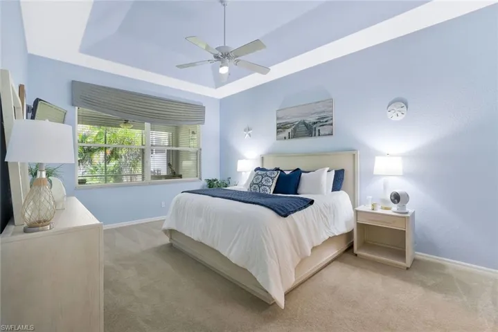 Bedroom featuring a tray ceiling
