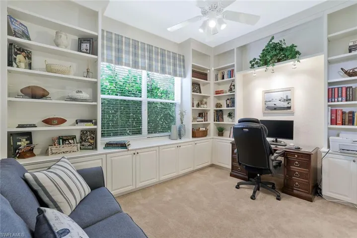 Wall to ceiling book shelves with built in cabinets