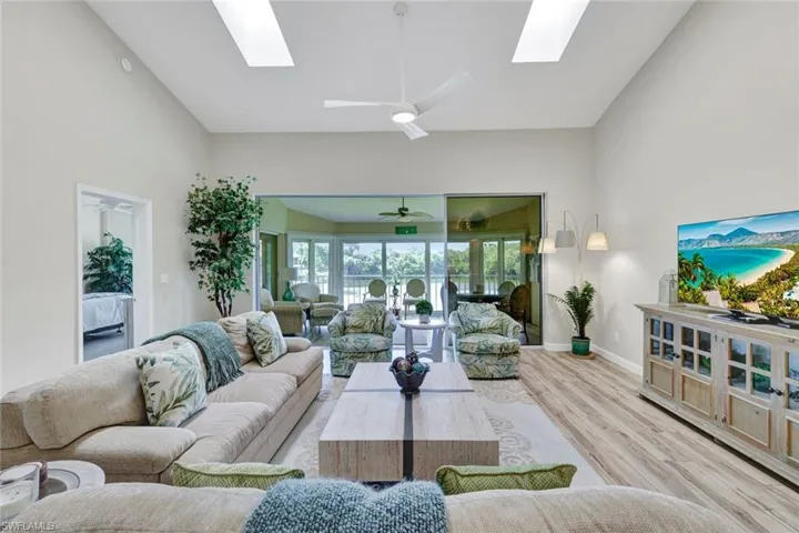 The living room is open and spacious, offering beautiful views from every angle and an inviting flow of natural light throughout.