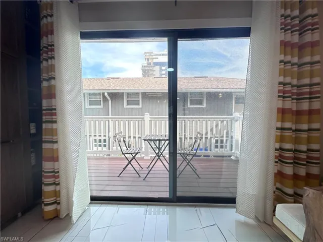 Doorway with tile patterned floors