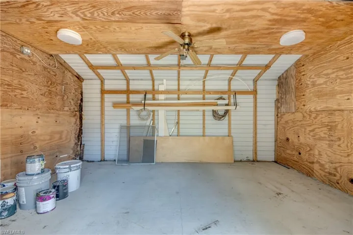 Garage featuring a ceiling fan