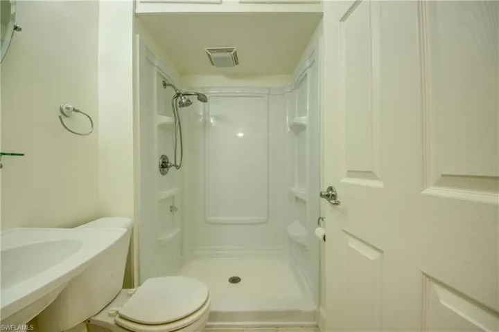Bathroom with a shower and toilet