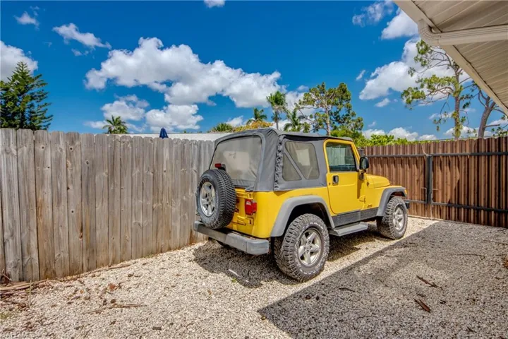 View of vehicle parking with fence