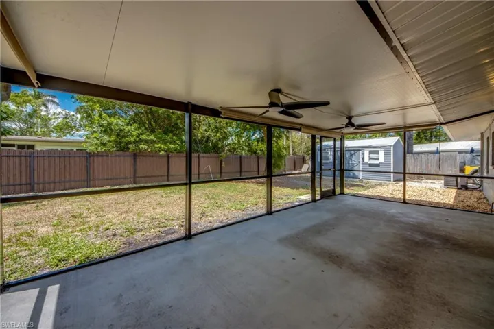 Unfurnished sunroom with a ceiling fan