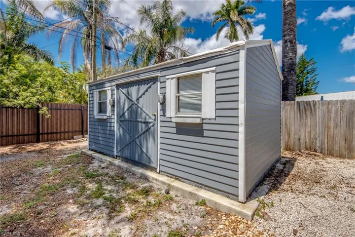 View of shed featuring a fenced backyard