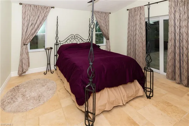 Main bedroom with slider to pool