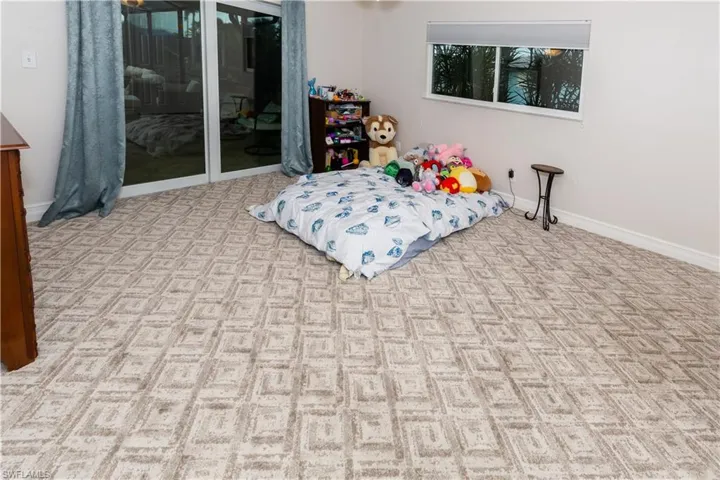 Bedroom 2 with slider to pool