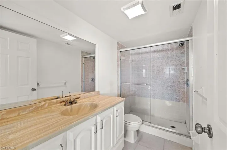 Primary bathroom with shower and vanity