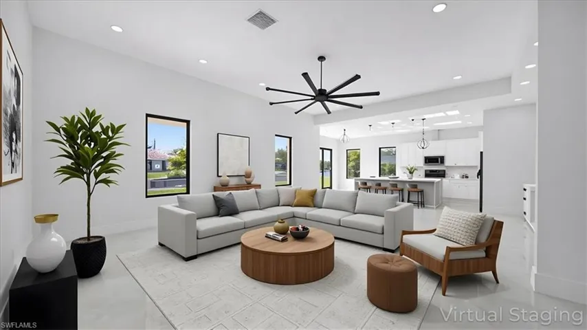 Living area with recessed lighting and ceiling fan