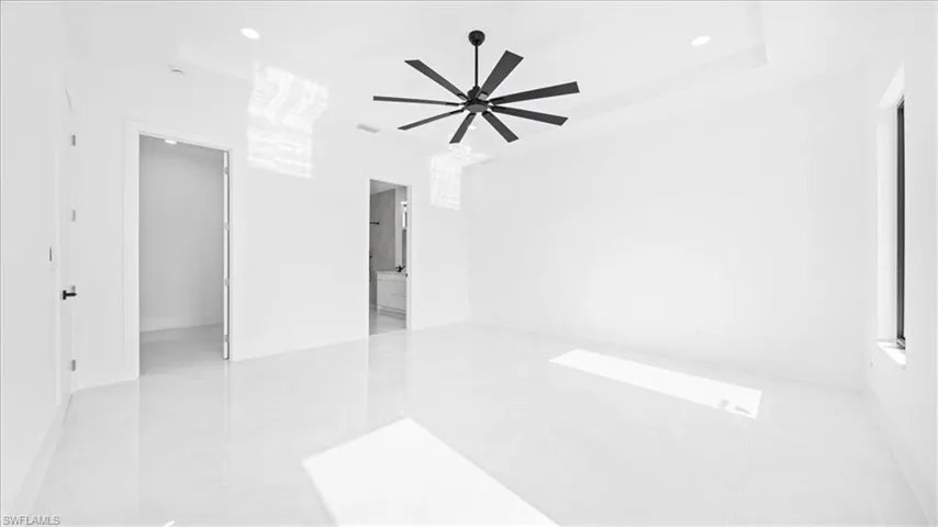 Empty room featuring recessed lighting and a ceiling fan
