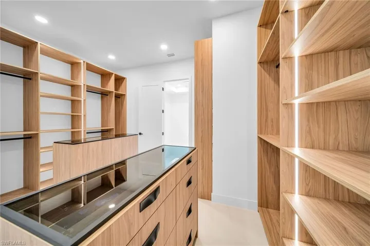 Spacious closet featuring light tile patterned flooring