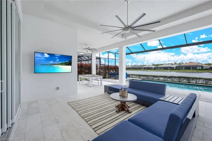 Tiled living room featuring ceiling fan