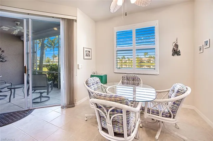 Tiled dining space with ceiling fan