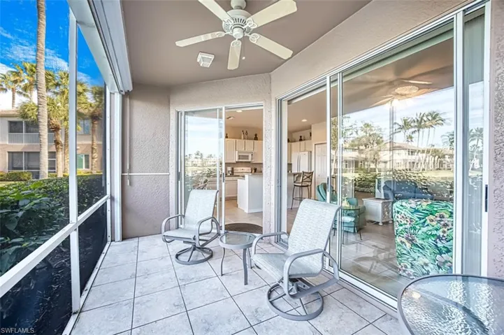 Sunroom / solarium featuring ceiling fan