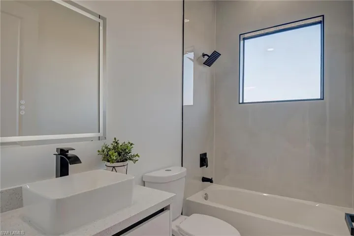 Full bathroom with tub / shower combination and vanity