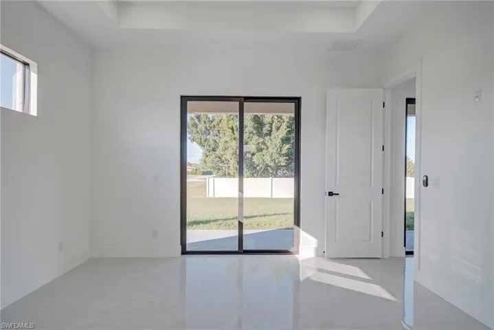 Spare room featuring a raised ceiling