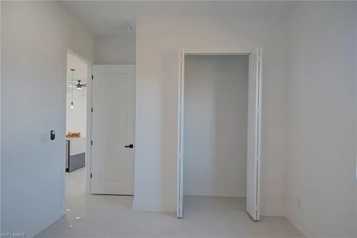 Unfurnished bedroom with baseboards