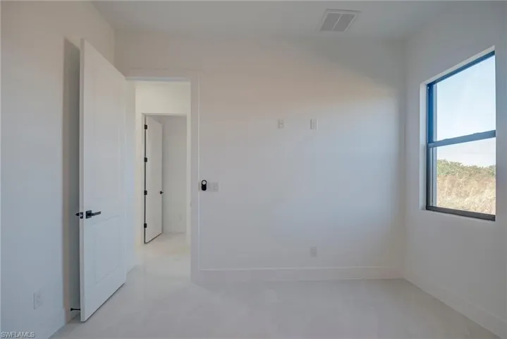 Unfurnished room featuring baseboards