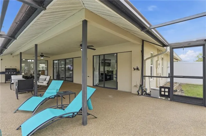 Sunroom with a ceiling fan