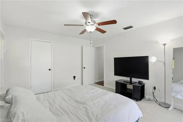Bedroom with carpet flooring and ceiling fan