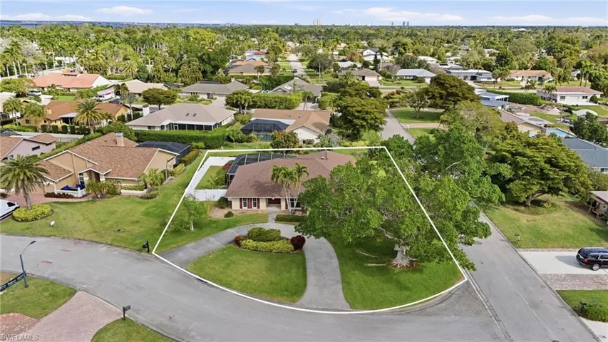 Aerial view of residential area with property parcel outlined