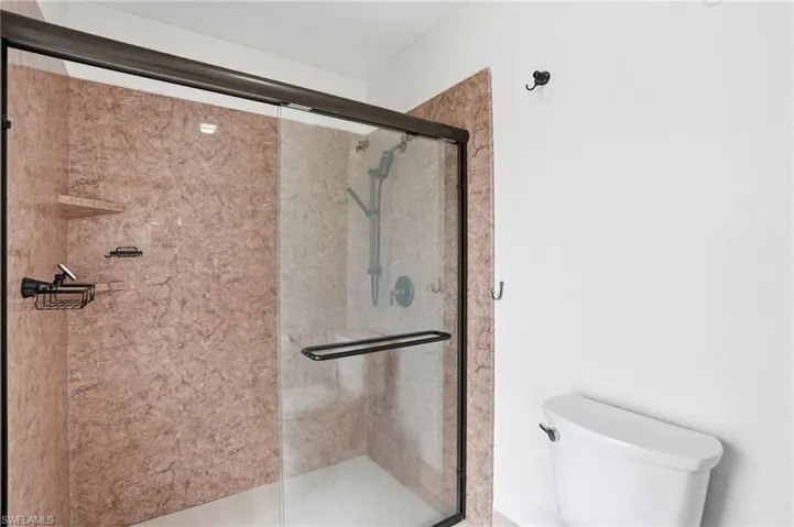 Bathroom featuring a shower stall