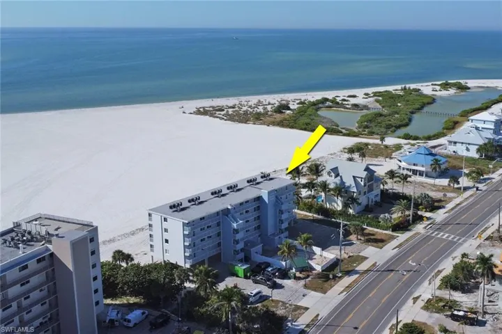 Drone / aerial view of waterfront with a beach