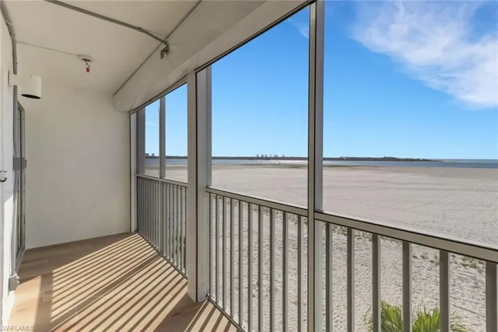 Unfurnished sunroom with a water view