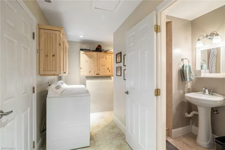 with guest bath off garage and laundry area