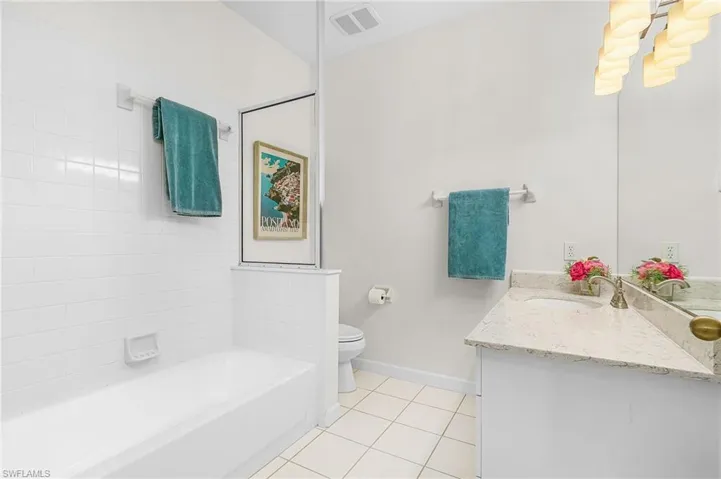 Bathroom for Bedroom #2 and Guests.  Has pocket door for ensuite access.