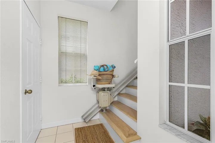 Wood stairs with chair lift - optional as it can be removed and entrance to garage