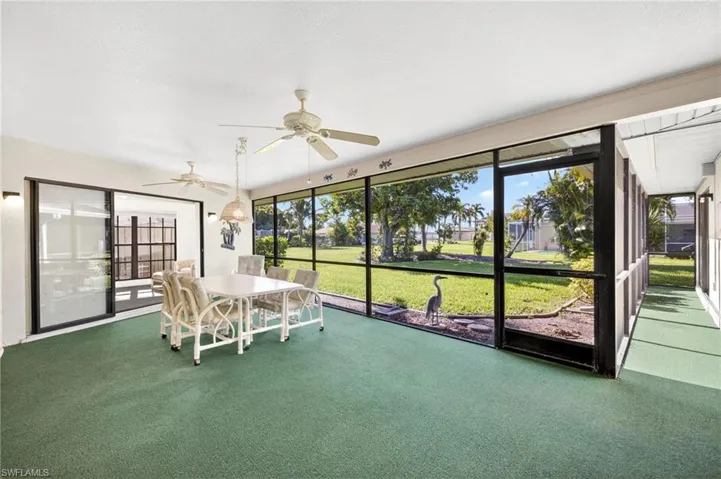 Sunroom / solarium with a ceiling fan, healthy amount of natural light, and outdoor dining space