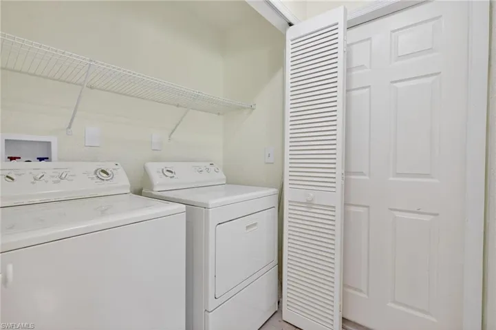 Laundry area with washer and clothes dryer
