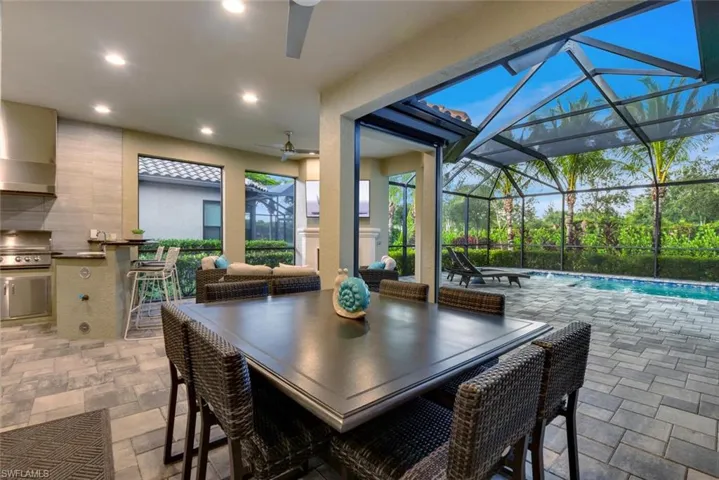 Sunroom featuring ceiling fan