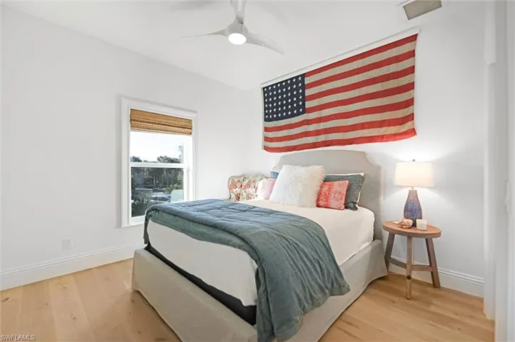 Bedroom featuring ceiling fan and engineered hardwood flooring