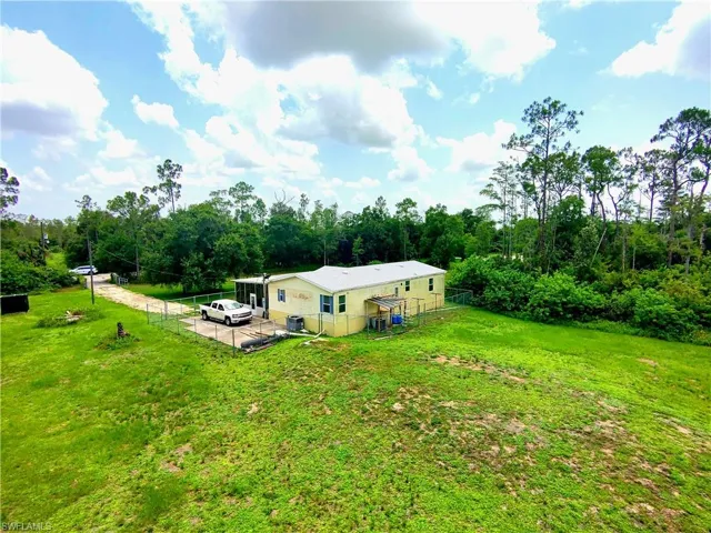 View from above of property featuring a forest