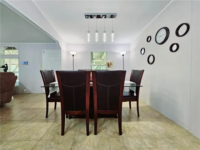 Dining room featuring light tile patterned floors