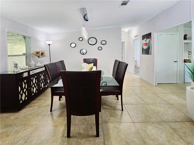 Dining room featuring light tile patterned floors