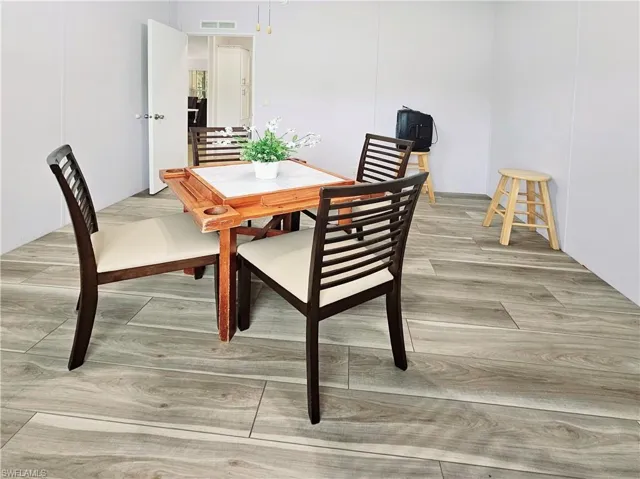 Dining area featuring light wood-style floors
